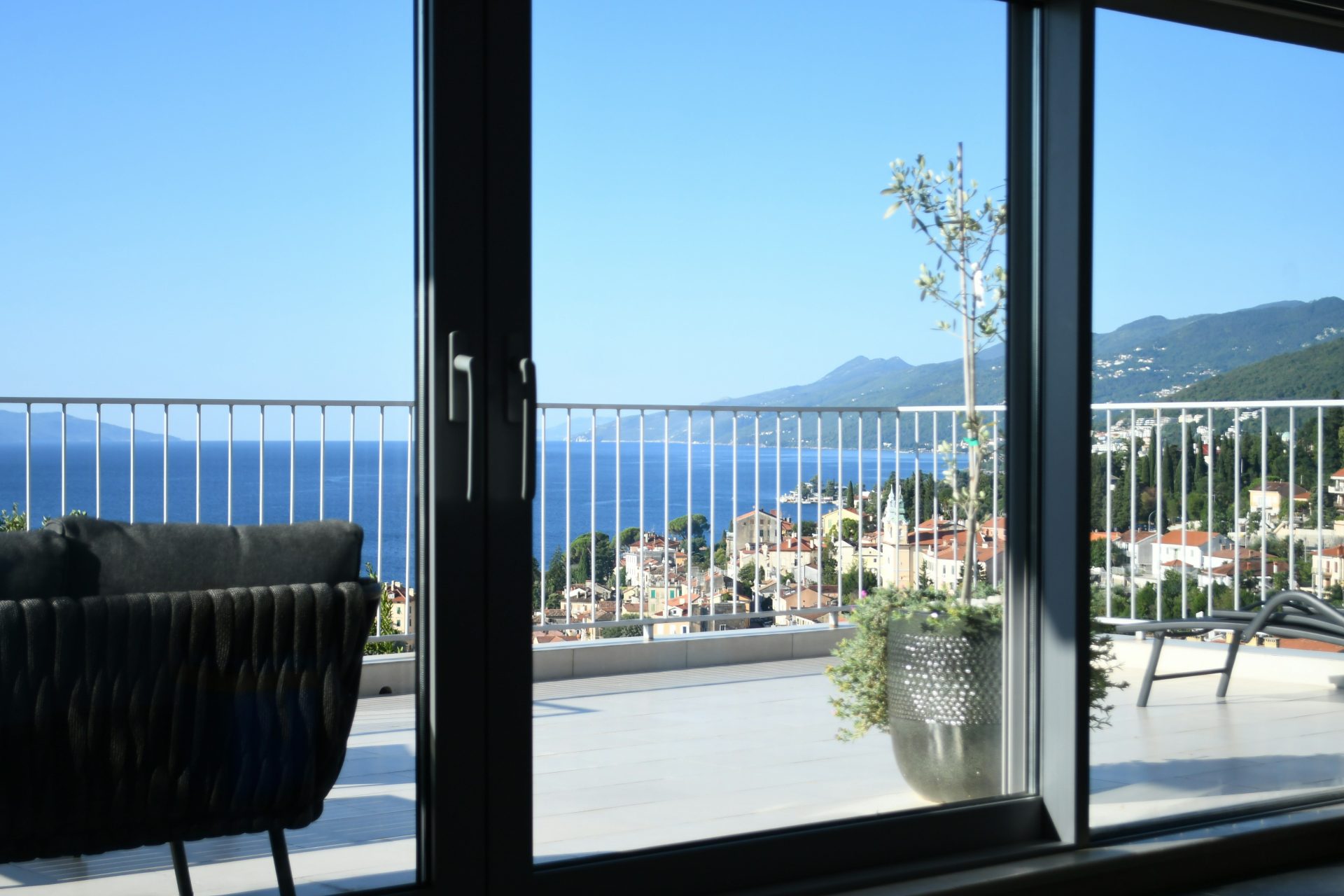 Balcony overlooking the sea and coastal town